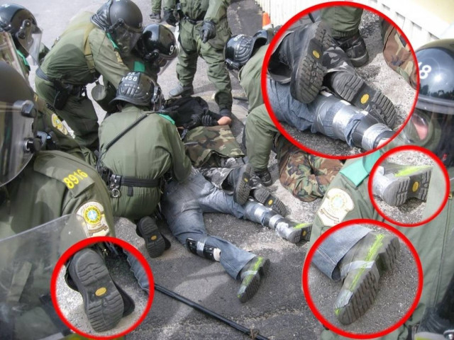 Ύποπτη φωτογραφία με κουκουλοφόρους και ΜΑΤ