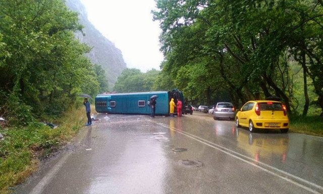 Intercity bus overturns, one woman slightly injured