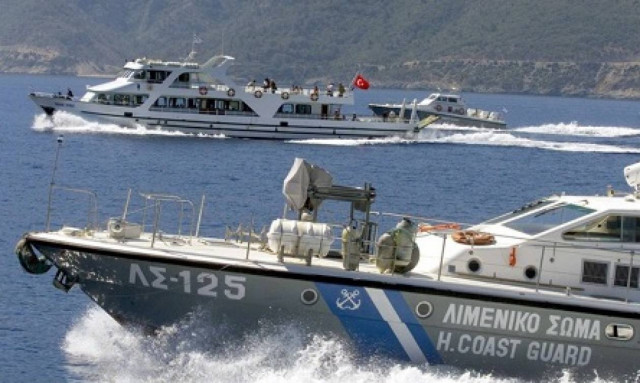 Greek coast guard says vessel intercepting migrant boat in video is not from its fleet