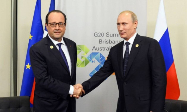 Ψυχρό κλίμα και παγωμένα πρόσωπα στη συνάντηση Πούτιν-Ολάντ