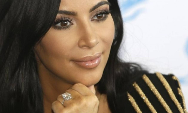 Kim Kardashian West sues over claims she faked robbery