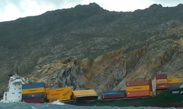 Rescue operation for crew members of freighter that run aground near Mykonos