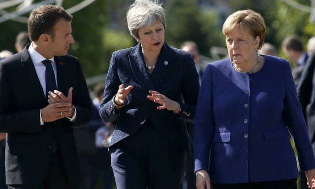 Μέρκελ, Μακρόν και Μέι κάνουν έκκληση διαλόγου για το πυρηνικό πρόγραμμα του Ιράν