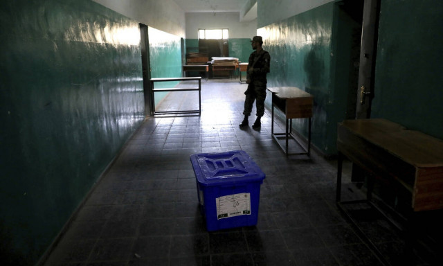 Afghan voters defy attacks, delays to choose president