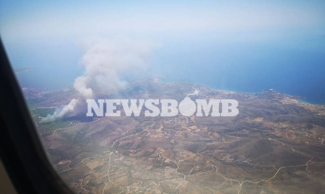 Fire raging in an area of forest in the Lavrio region