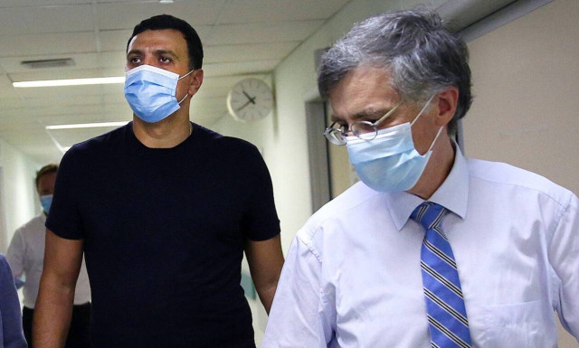 Kikilias and Tsiodras observe Covid-19 testing by mobile unit in downtown Athens	