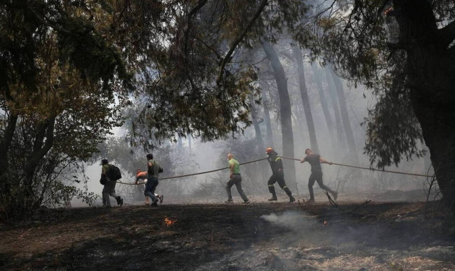 Two fire-fighters injured after their vehicle overturns