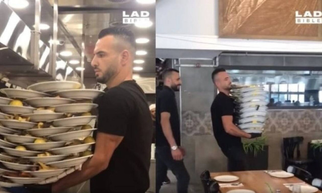 Αδιανόητος σερβιτόρος κουβαλάει 33 πιάτα με τη μία (vid)