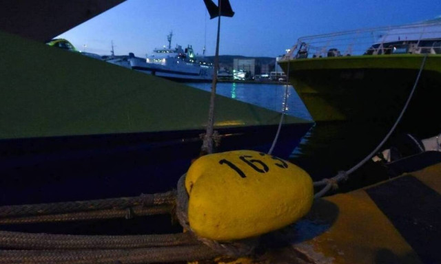 Boats remain docked as the Aegean is lashed by gale-force winds
