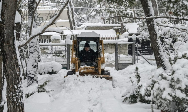 Snowfall, low temperatures, and icy conditions to continue to midday Wednesday