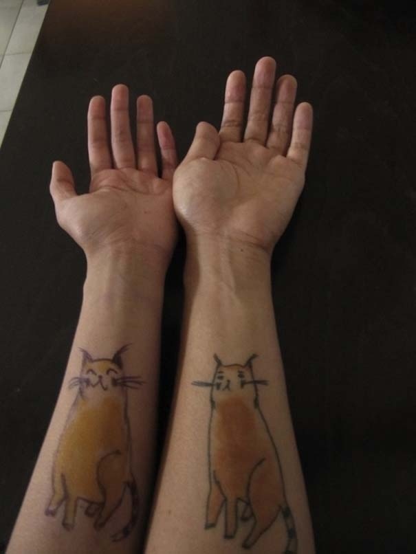 Λατρεύουν τις γάτες και τις έκαναν τατουάζ!(pics)