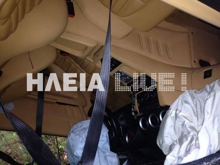 Ferrari stuck between trees! (pics)