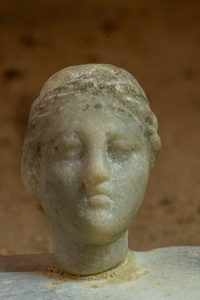 small white marble statuette of a woman wearing the royal diadem