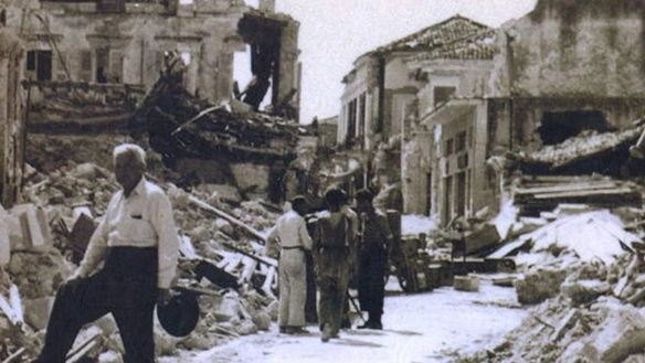 people walking down a street with rubble