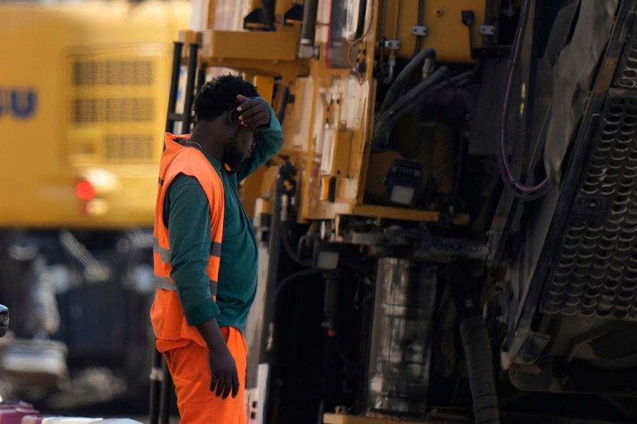 milan worker heat wave