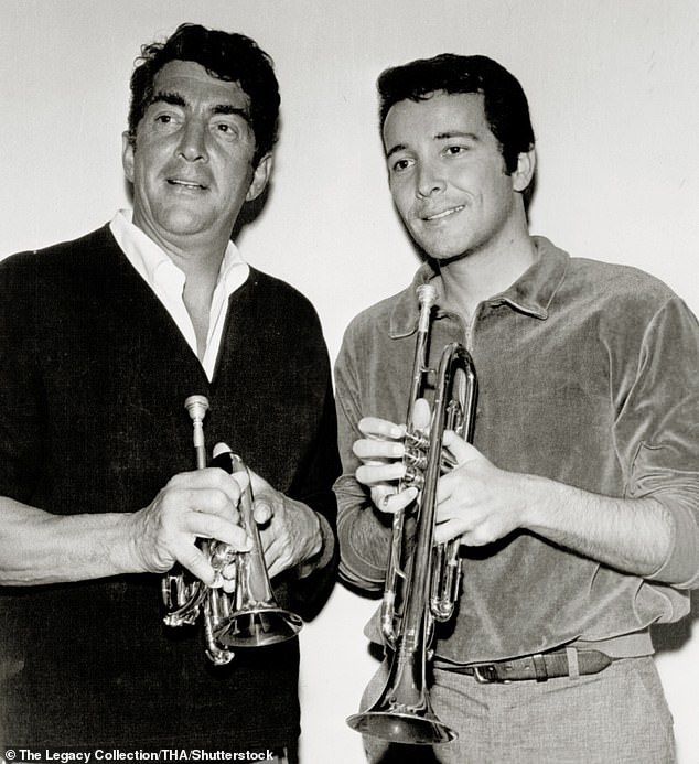 A trip to Tijuana in 1962 inspired his unique sound and by 1965 he was top of the charts with Whipped Cream & Other Delights (pictured: Herb with Dean Martin in 1963)