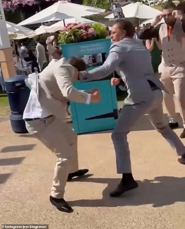 A shocking video has emerged online of two men, who were suited and booted, viciously swinging punches at one another, at the prestigious Berkshire event