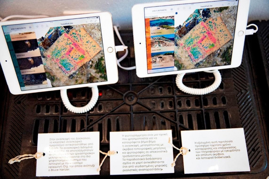 Two white tablets with a couple of white tagsAI-generated content may be incorrect.