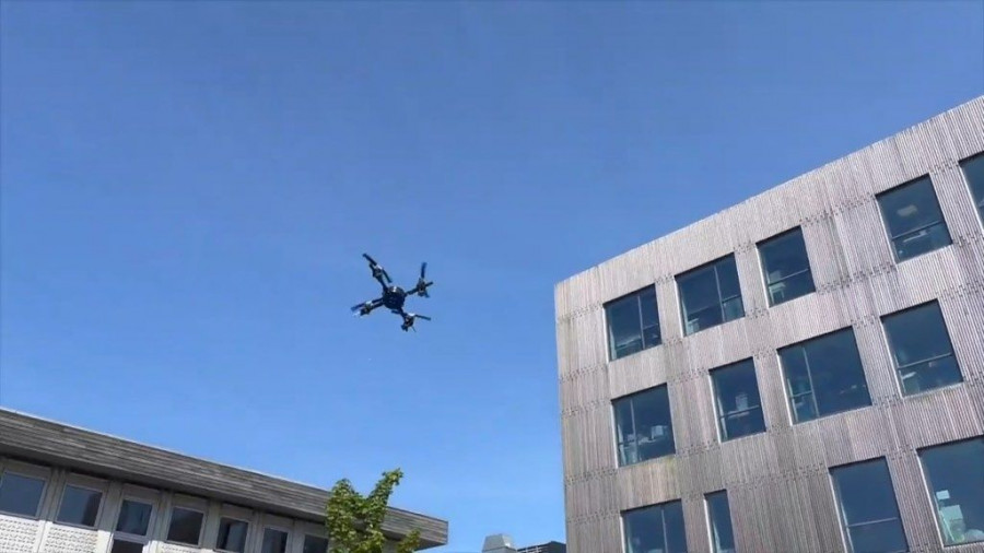 The drone hovers above the water before diving in for another flawless swim.