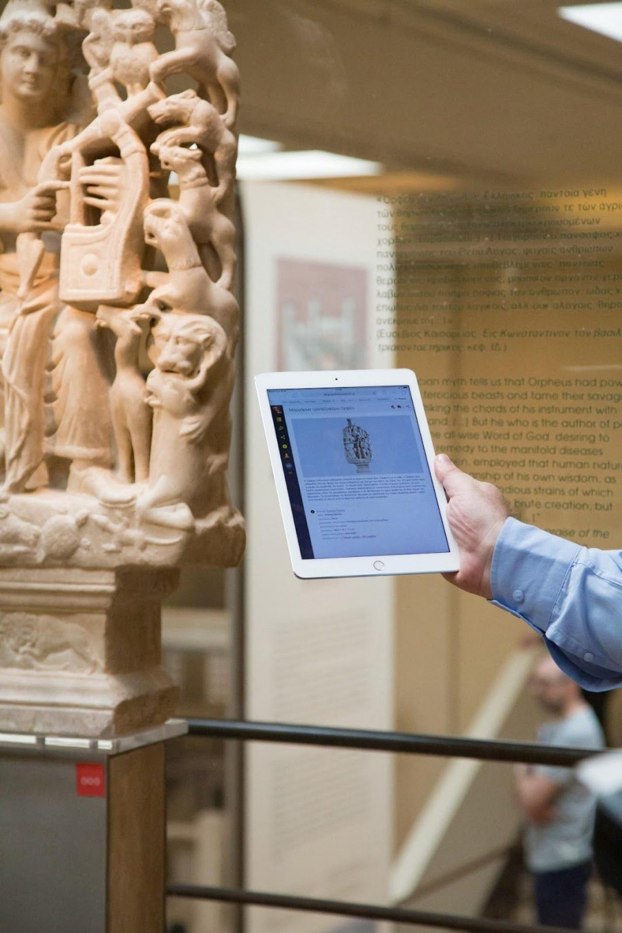A person holding a tabletAI-generated content may be incorrect.