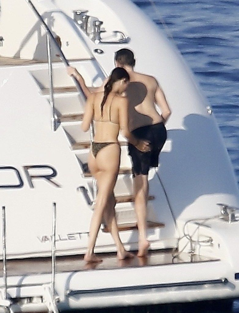 Vittoria Ceretti spanks Leonardo DiCaprio during their vacation.