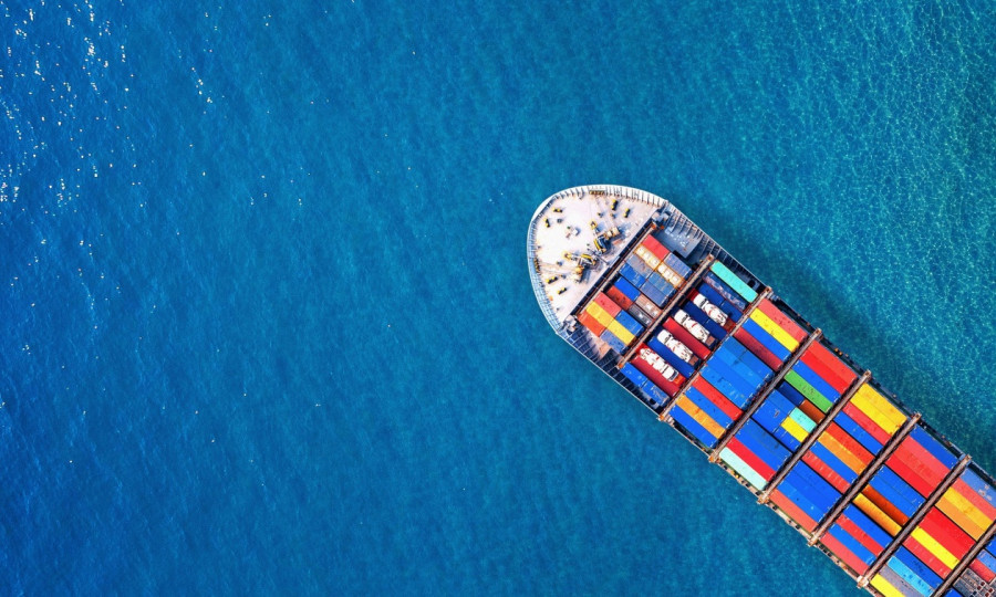 7e65f661-aerial-view-container-cargo-ship-sea.jpg