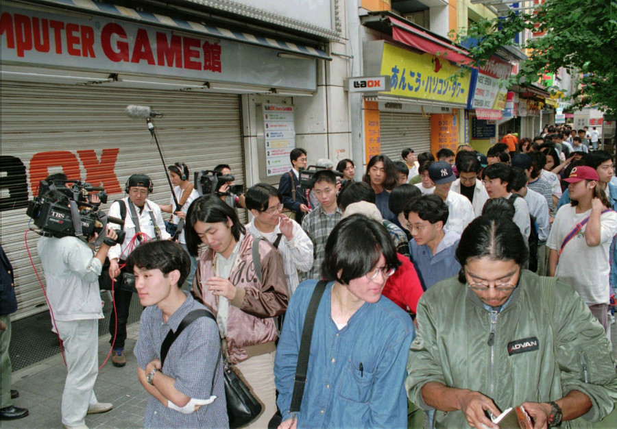 PEOPLE STAND IN LINE