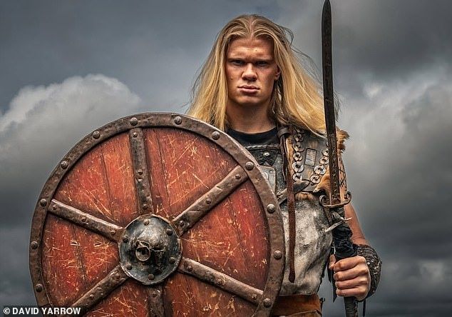 Erling Haaland poses with Viking gear on for the photoshoot prior to Norway heading to the World Cup